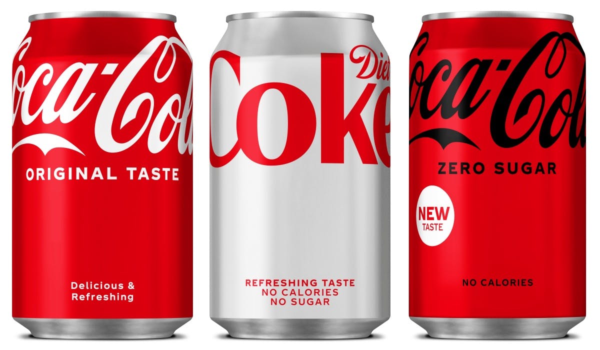 Coca-Cola, Diet Coke and Coca-Cola Zero Sugar cans in a row.